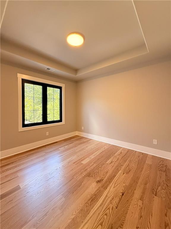3700 Robinson Road Northeast Marietta, GA 30068 - Photo 33 of 49 an empty room with wooden floor and windows