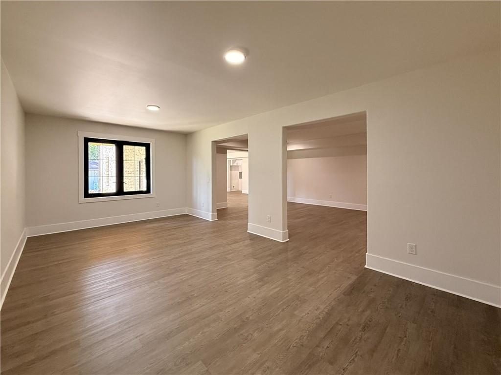 3700 Robinson Road Northeast Marietta, GA 30068 - Photo 39 of 49 an empty room with wooden floor and windows