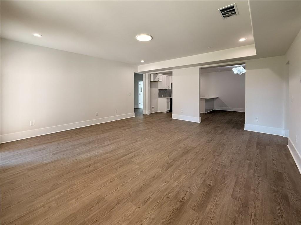 3700 Robinson Road Northeast Marietta, GA 30068 - Photo 40 of 49 an empty room with wooden floor and windows