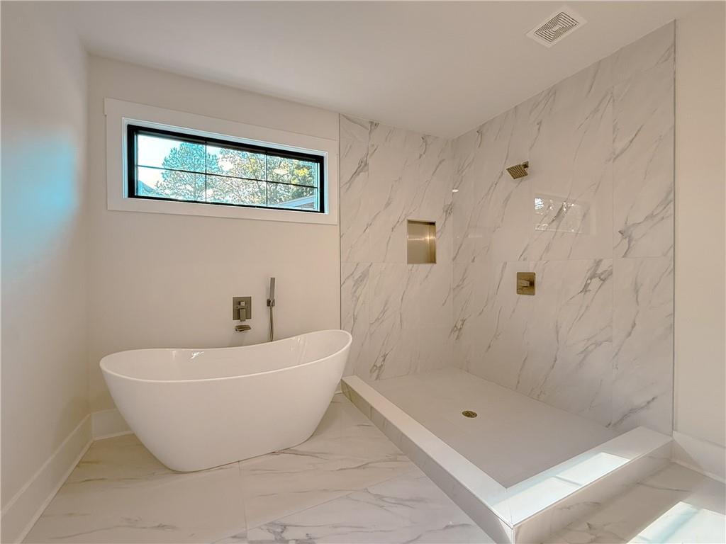 3700 Robinson Road Northeast Marietta, GA 30068 - Photo 42 of 49 a bathroom with a bathtub and shower