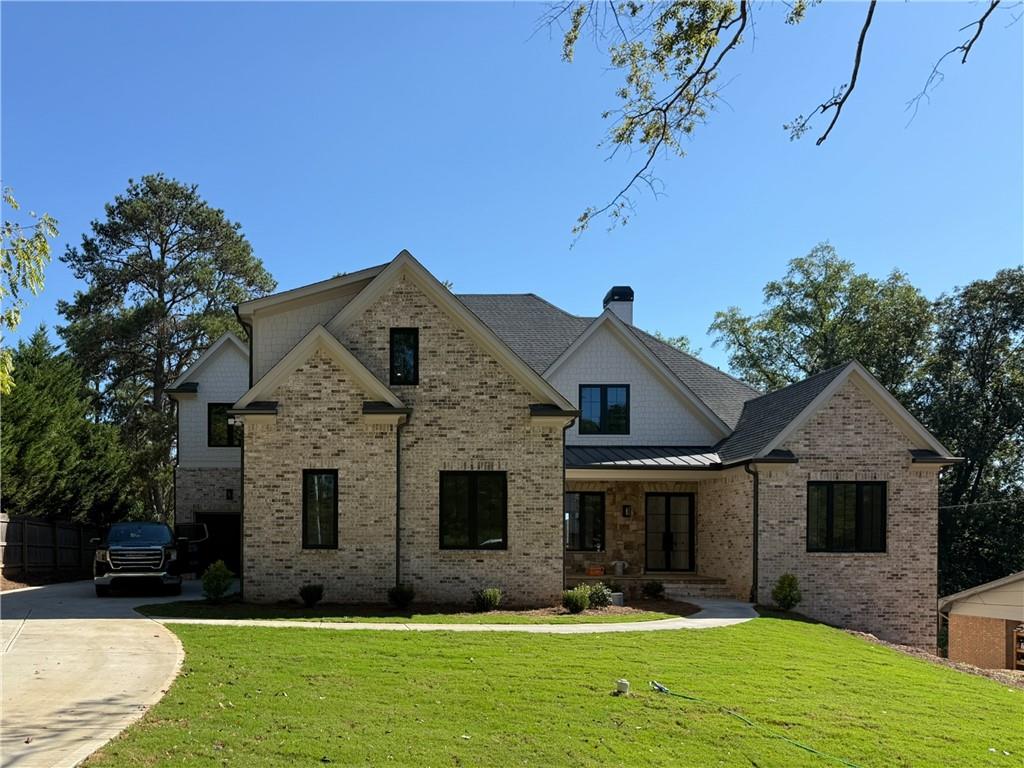 3700 Robinson Road Northeast Marietta, GA 30068 - Photo 43 of 49 a front view of a house with a yard