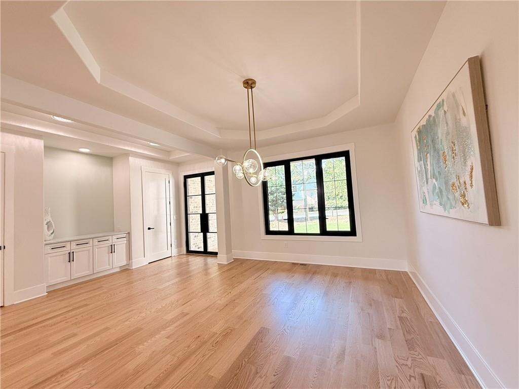 3700 Robinson Road Northeast Marietta, GA 30068 - Photo 6 of 49 a view of an empty room with window and wooden floor