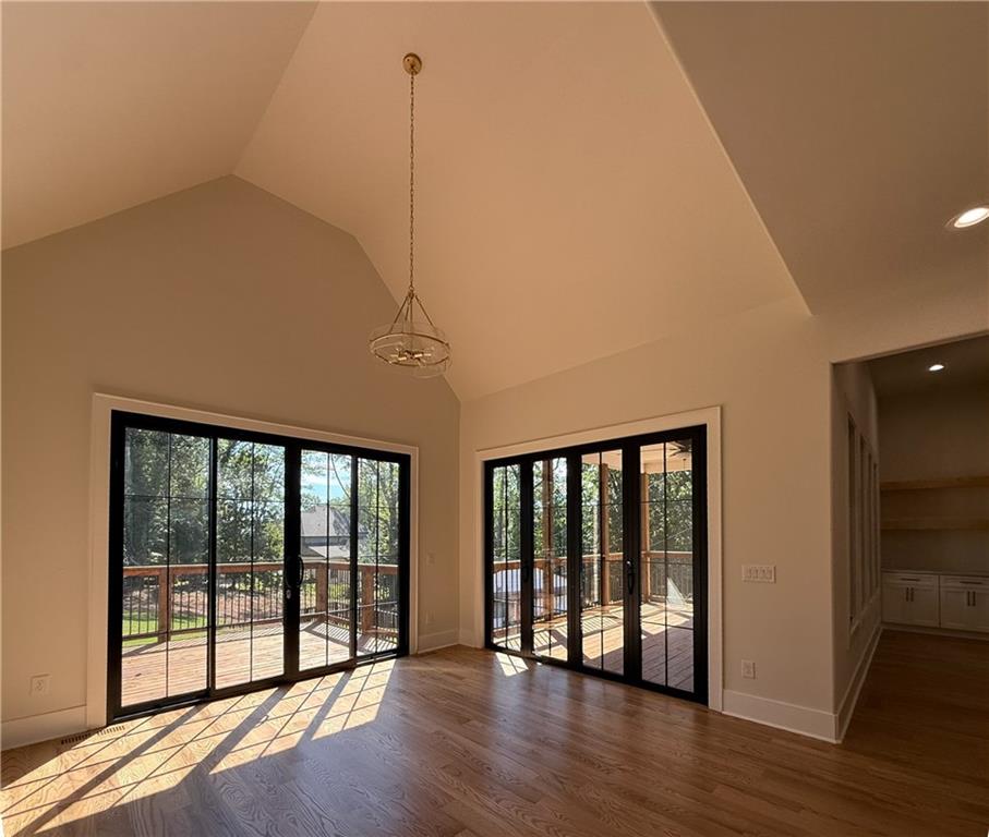 3700 Robinson Road Northeast Marietta, GA 30068 - Photo 10 of 49 a view of an empty room with wooden floor and a window