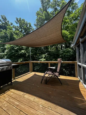 a view of outdoor space with wooden floor