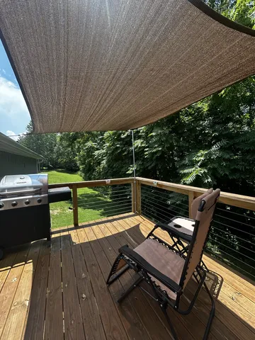 a view of a two chairs in the balcony