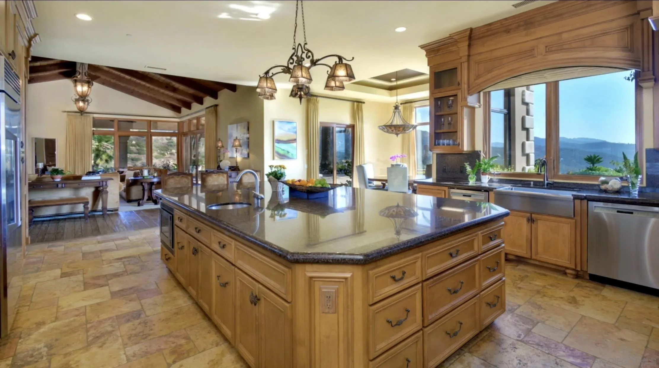 14155 Bryce Point Poway, CA 92064 - Photo 21 of 71 a kitchen with stainless steel appliances granite countertop a sink a counter space and a view of living room