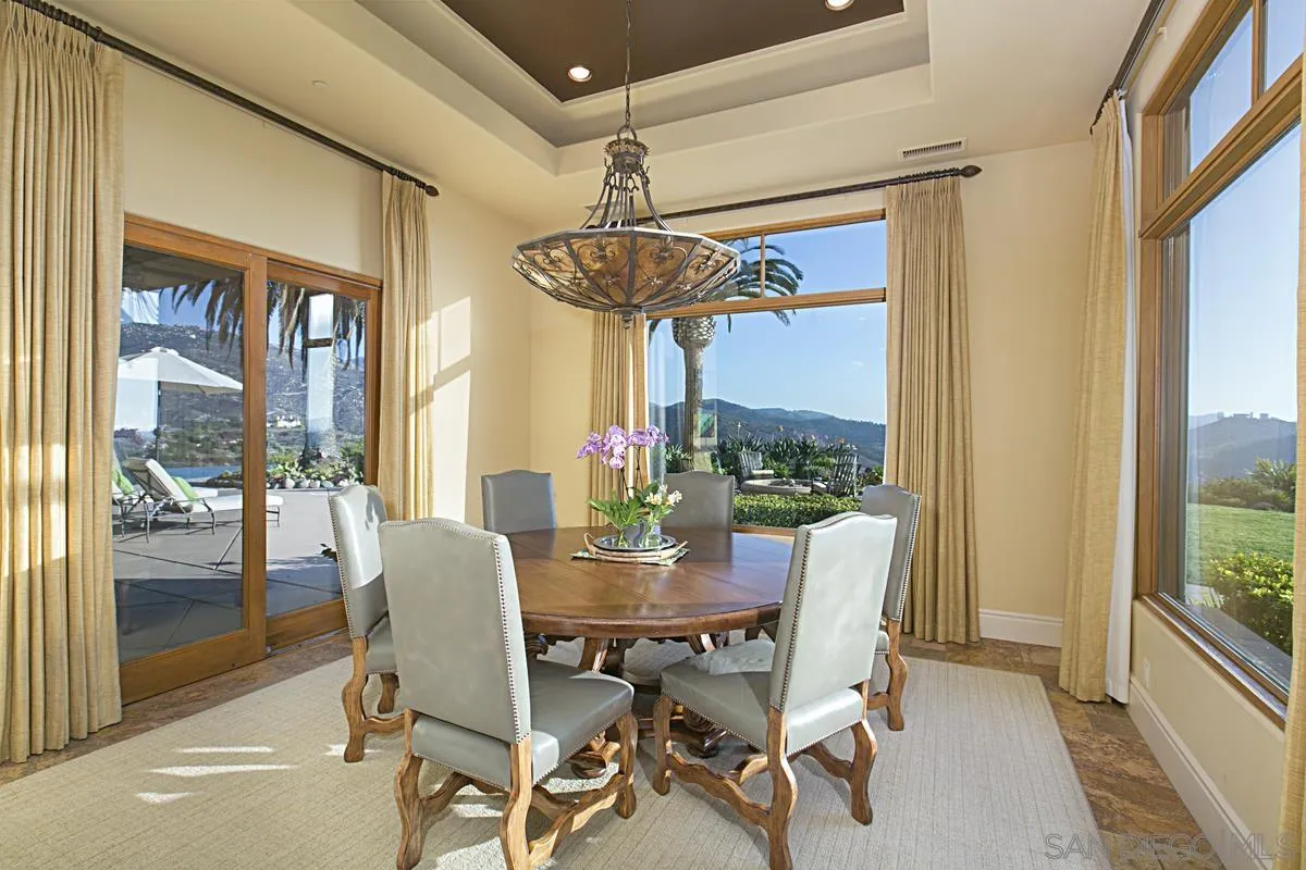 14155 Bryce Point Poway, CA 92064 - Photo 23 of 71 a dining room with furniture a chandelier and wooden floor