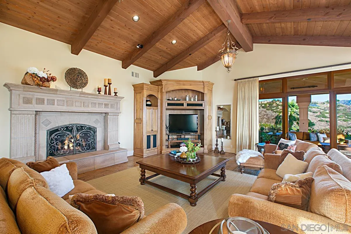 14155 Bryce Point Poway, CA 92064 - Photo 24 of 71 a living room with furniture fireplace and a large window