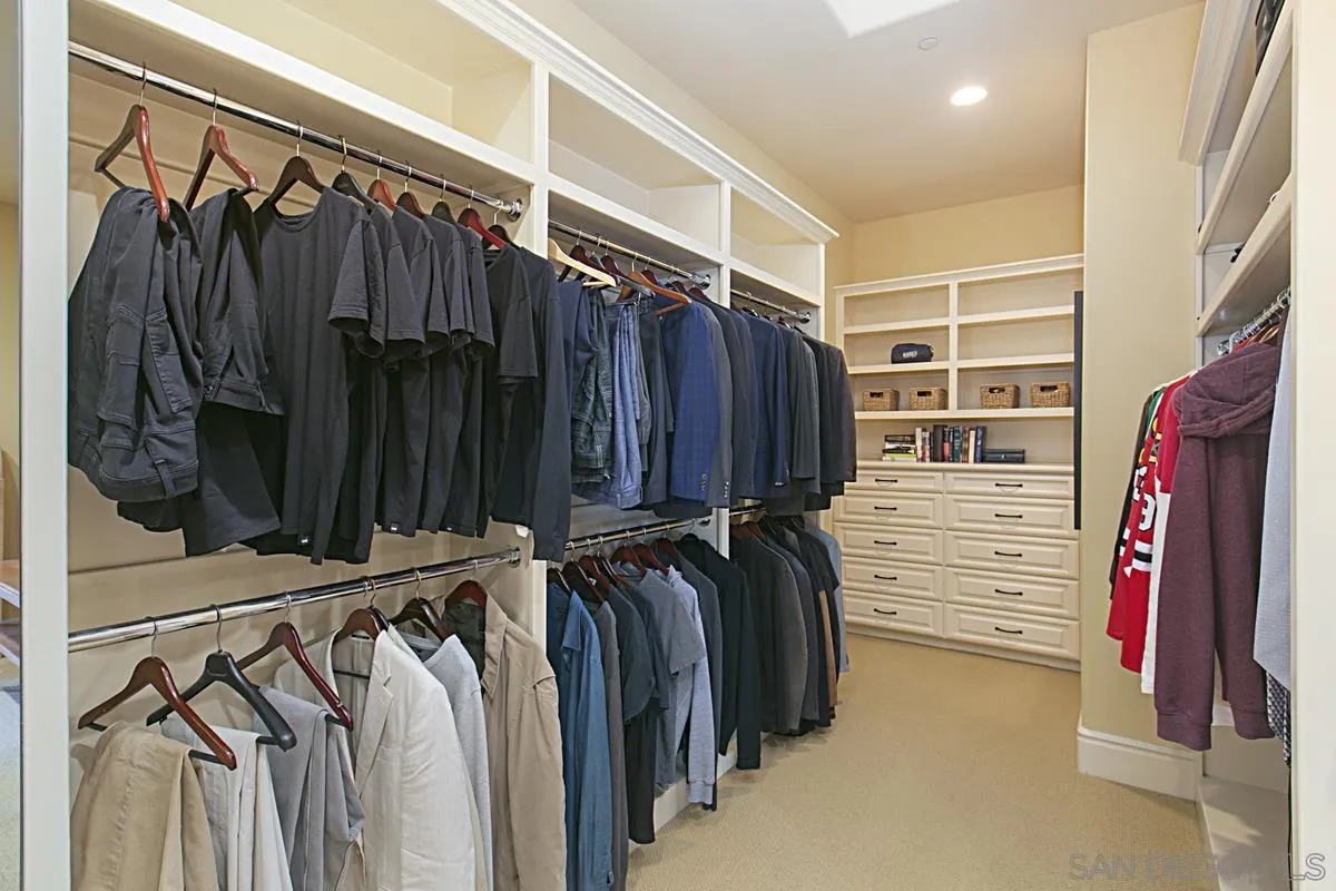 14155 Bryce Point Poway, CA 92064 - Photo 36 of 71 a view of walk in closet with clothes and shoes
