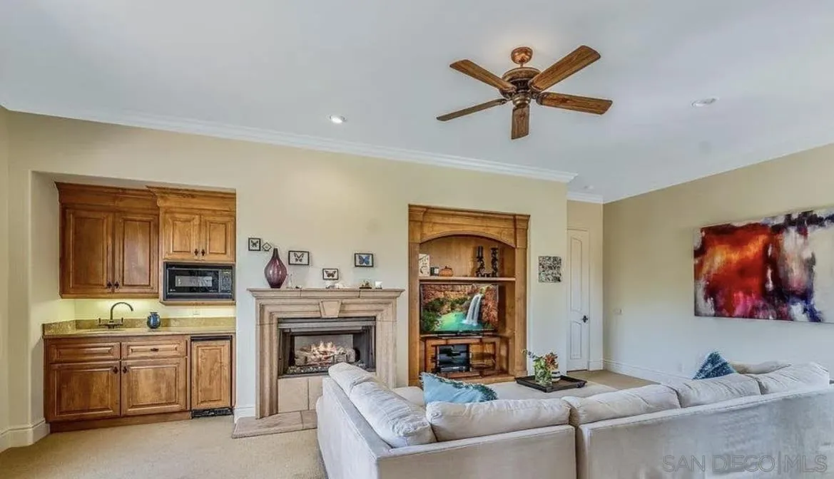 14155 Bryce Point Poway, CA 92064 - Photo 38 of 71 a living room with furniture and a fireplace