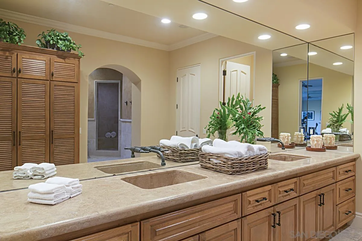 14155 Bryce Point Poway, CA 92064 - Photo 48 of 71 a bathroom with a granite countertop sink and a mirror