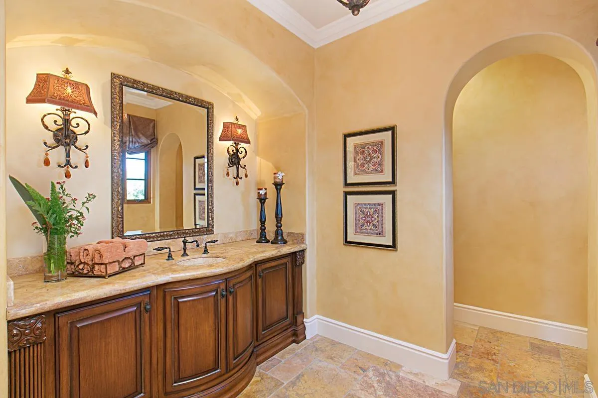 14155 Bryce Point Poway, CA 92064 - Photo 49 of 71 a spacious bathroom with a granite countertop sink and a mirror