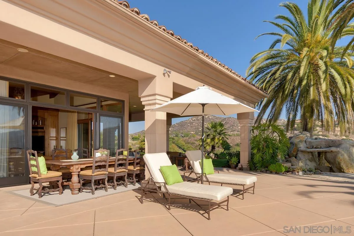 14155 Bryce Point Poway, CA 92064 - Photo 53 of 71 a view of a patio with a table and chairs under an umbrella