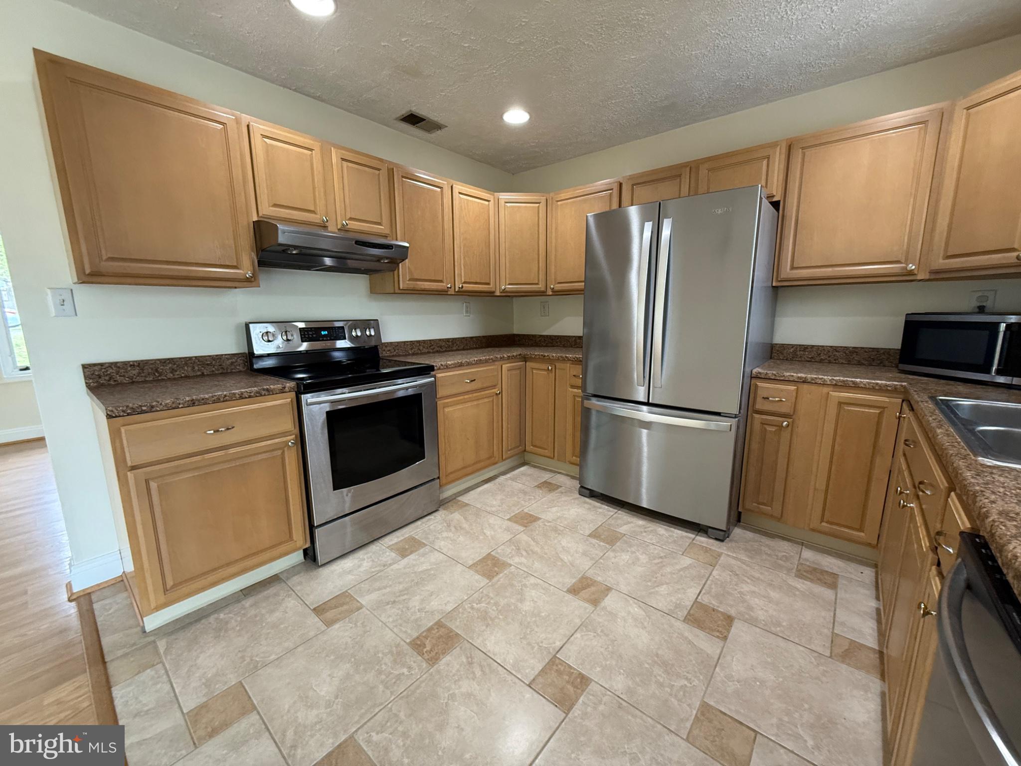 416 Breslin Road Joppa, MD 21085 - Photo 11 of 32 Modern kitchen with warm wood tones.