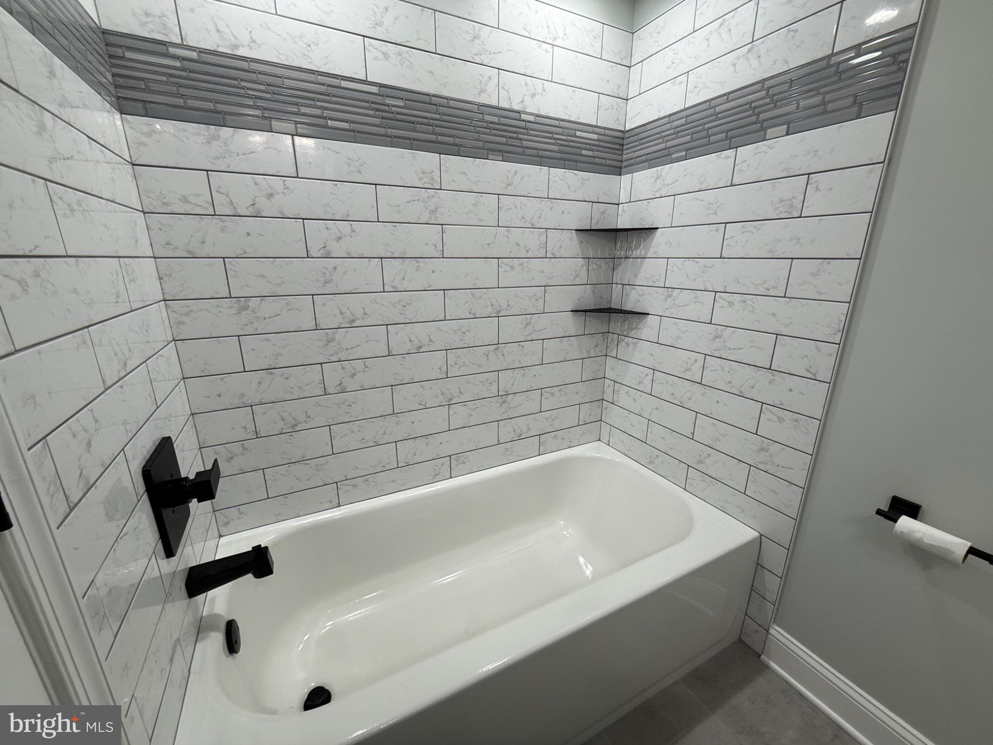 416 Breslin Road Joppa, MD 21085 - Photo 27 of 32 Sleek modern bath with elegant tiles.