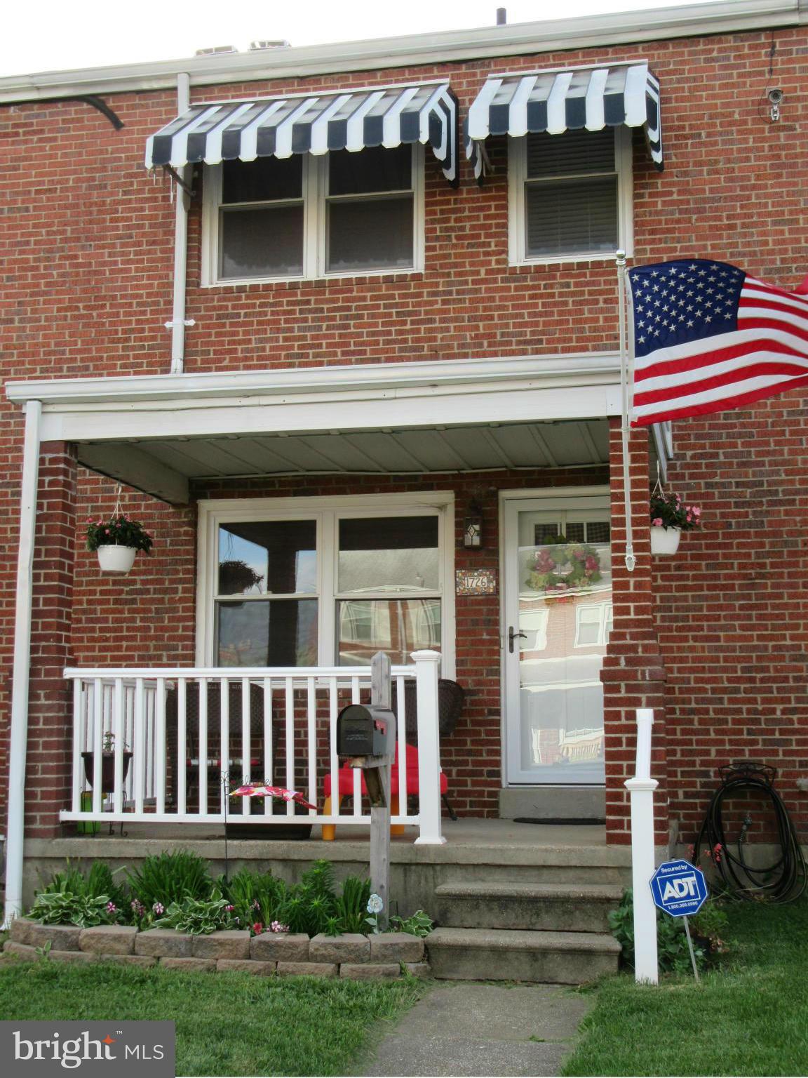 1726 Stokesley Road Baltimore, MD 21222 - Photo 1 of 23 a front view of a house with a yard