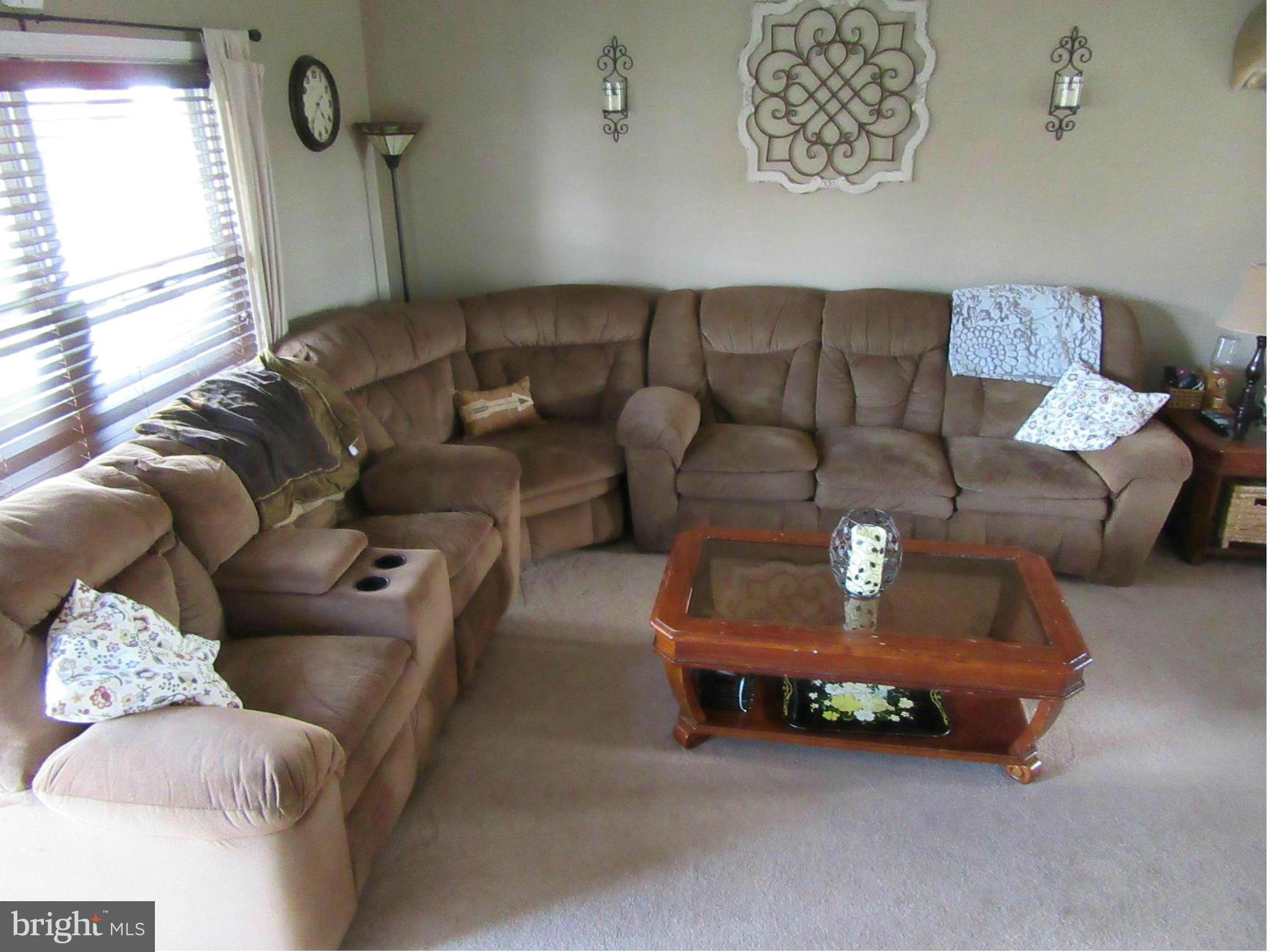 1726 Stokesley Road Baltimore, MD 21222 - Photo 2 of 23 a living room with furniture and a window