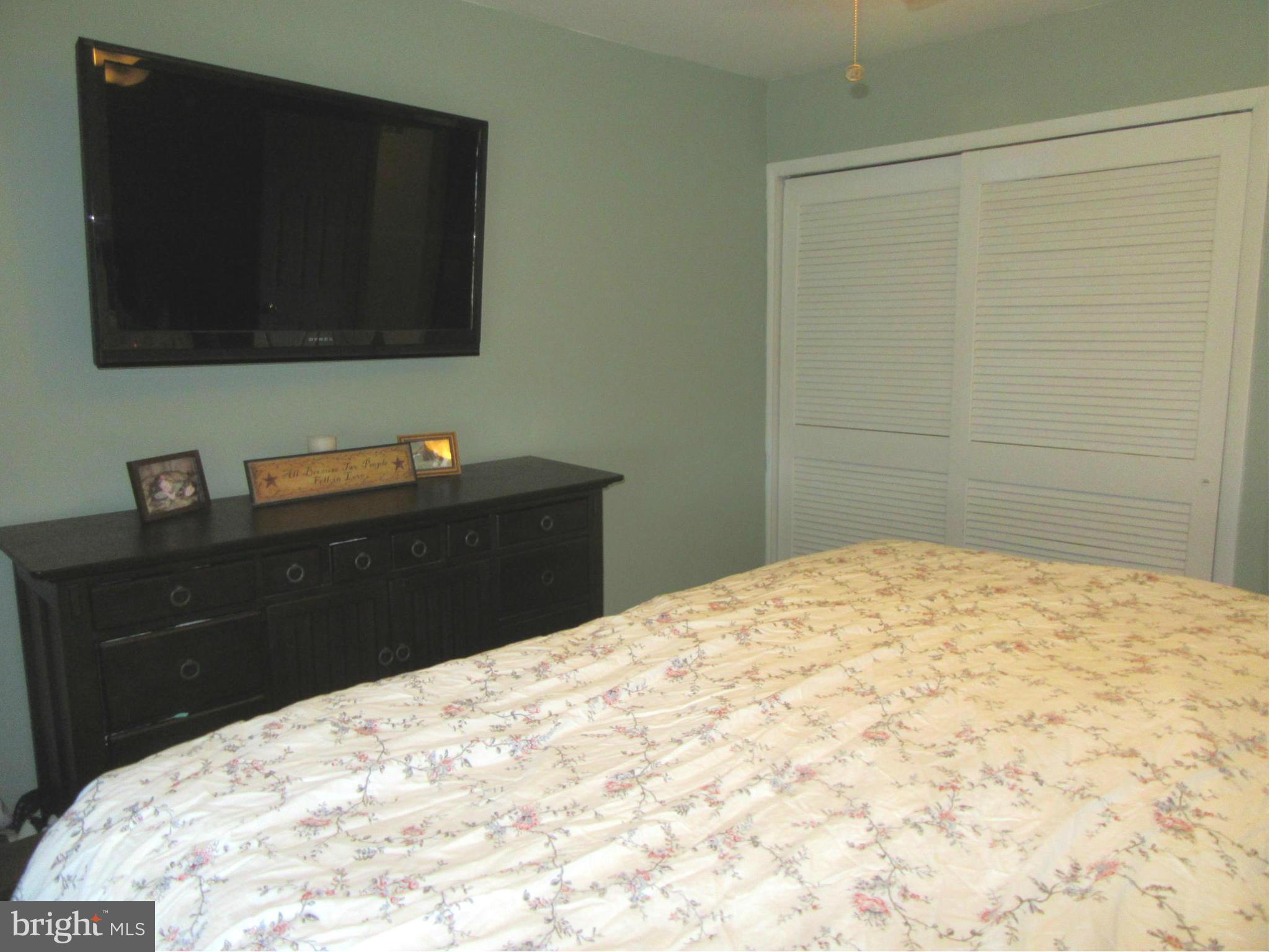 1726 Stokesley Road Baltimore, MD 21222 - Photo 16 of 23 a bedroom with a bed and a flat screen tv