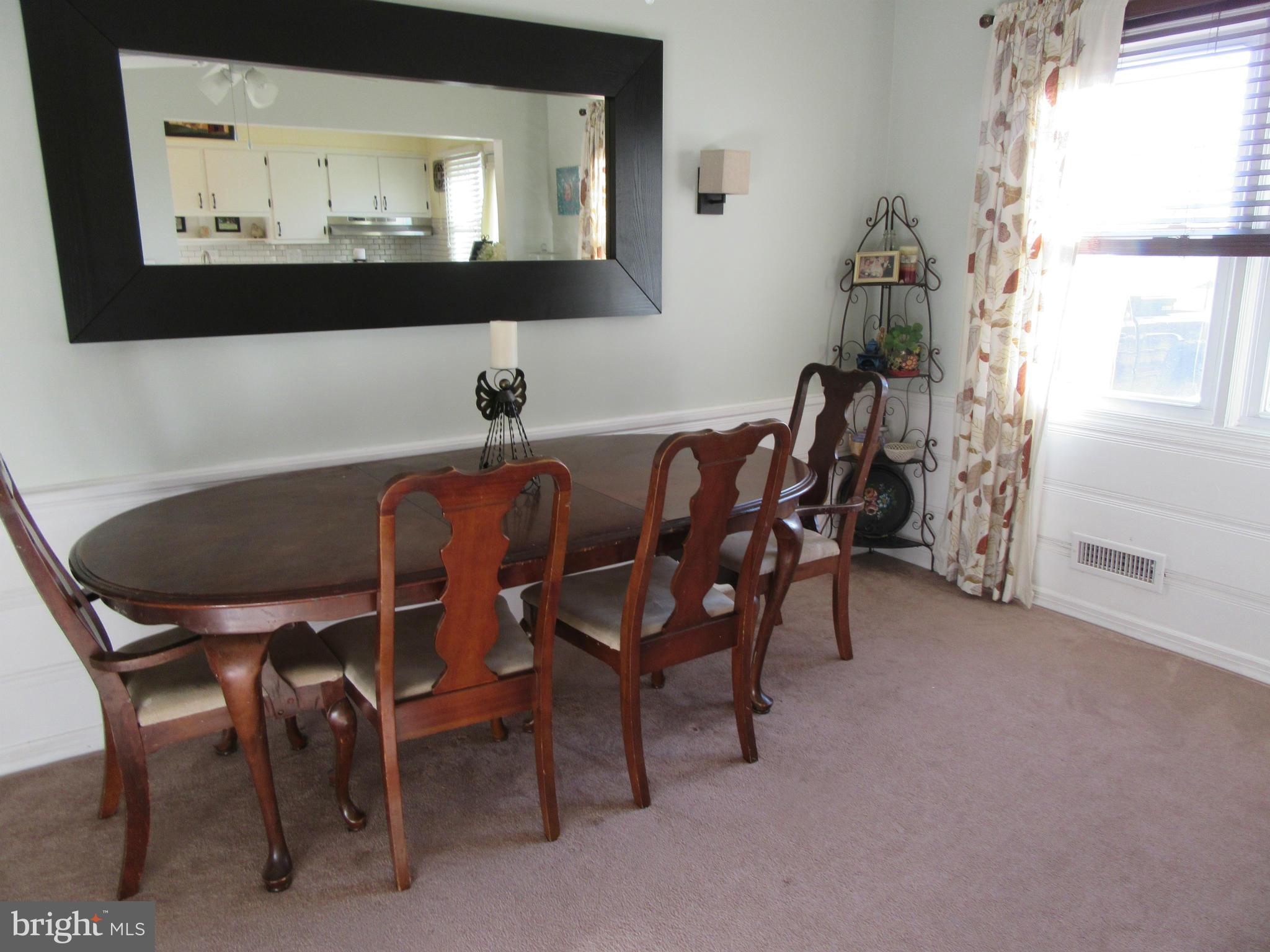 1726 Stokesley Road Baltimore, MD 21222 - Photo 7 of 23 a view of a dining room with furniture and window