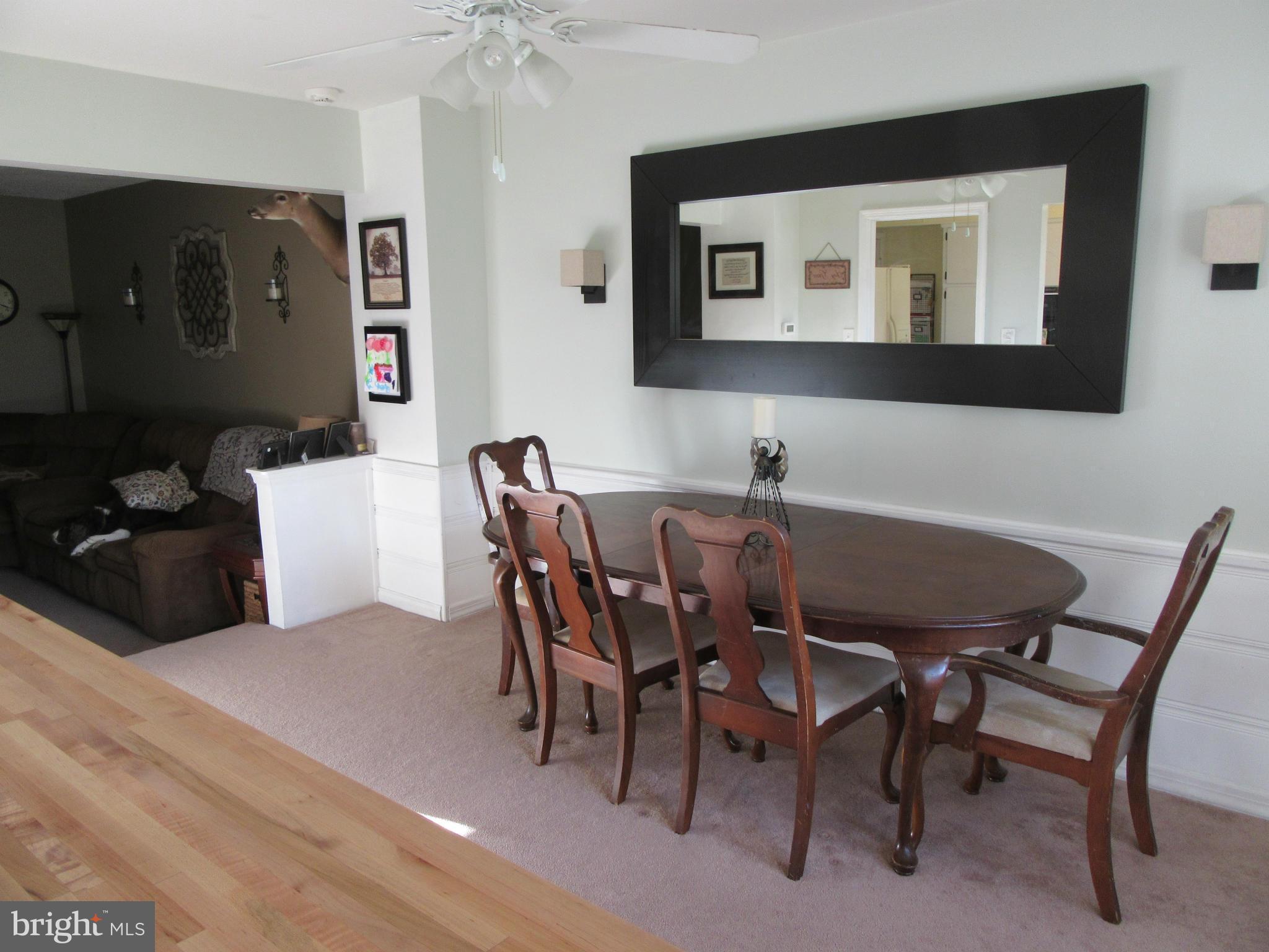 1726 Stokesley Road Baltimore, MD 21222 - Photo 8 of 23 a view of a dining room with furniture and wooden floor