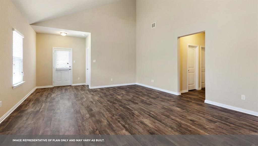 14909 Custis Lane Austin, TX 78725 - Photo 20 of 21 an empty room with wooden floor and mirror