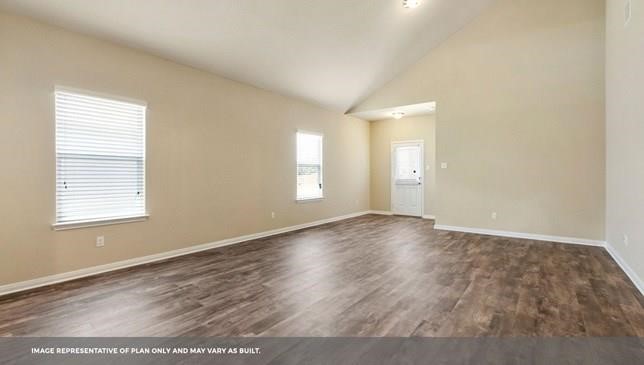 14909 Custis Lane Austin, TX 78725 - Photo 21 of 21 an empty room with wooden floor and windows