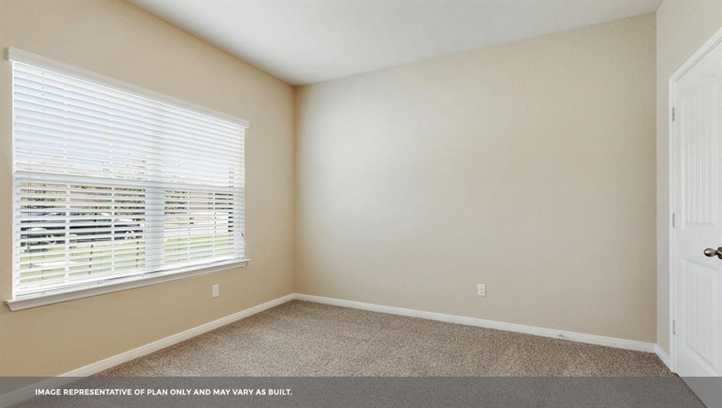 14909 Custis Lane Austin, TX 78725 - Photo 9 of 21 a view of an empty room with a window