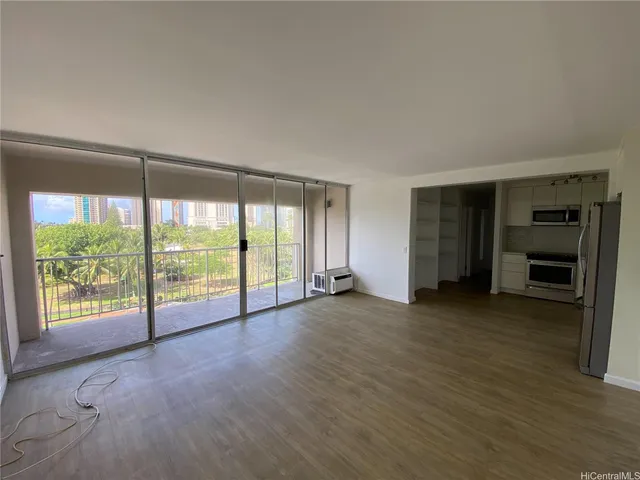 a view of an empty room with a window