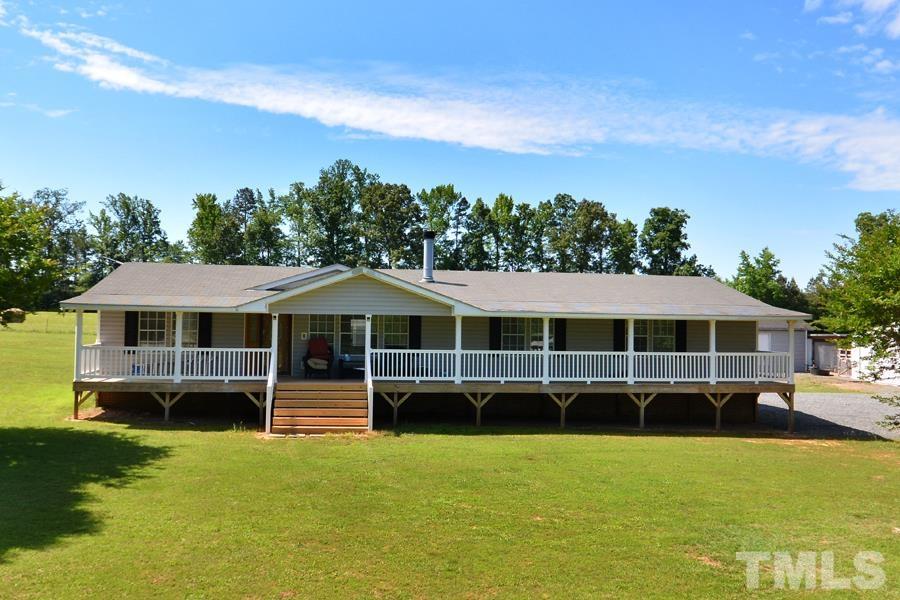 548 Duke Drive Rougemont, NC 27572 - Photo 1 of 43 a front view of a house with a garden