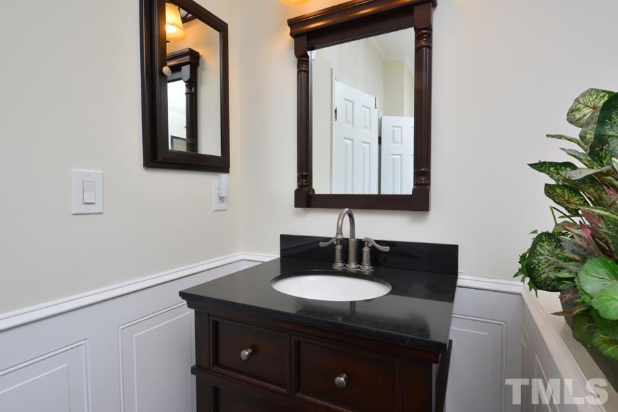 548 Duke Drive Rougemont, NC 27572 - Photo 15 of 43 a bathroom with a sink vanity and a mirror