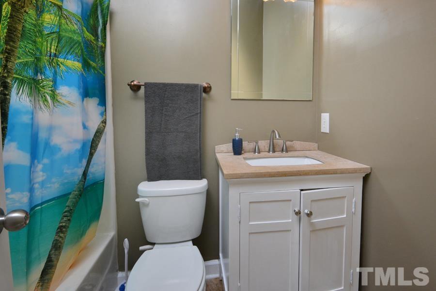 548 Duke Drive Rougemont, NC 27572 - Photo 23 of 43 a bathroom with a toilet sink and shower