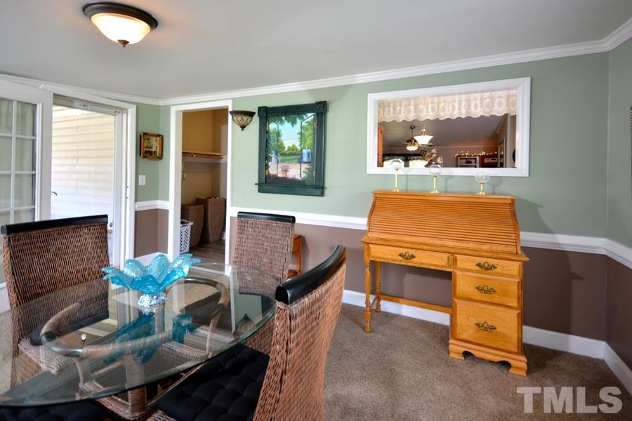 548 Duke Drive Rougemont, NC 27572 - Photo 26 of 43 a living room with furniture and a flat screen tv