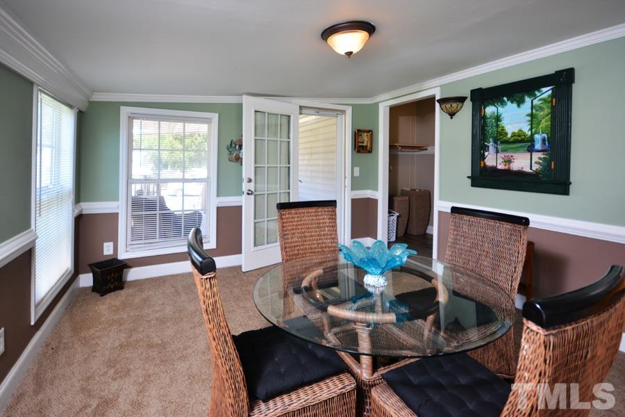 548 Duke Drive Rougemont, NC 27572 - Photo 27 of 43 a living room with fireplace furniture and a large window