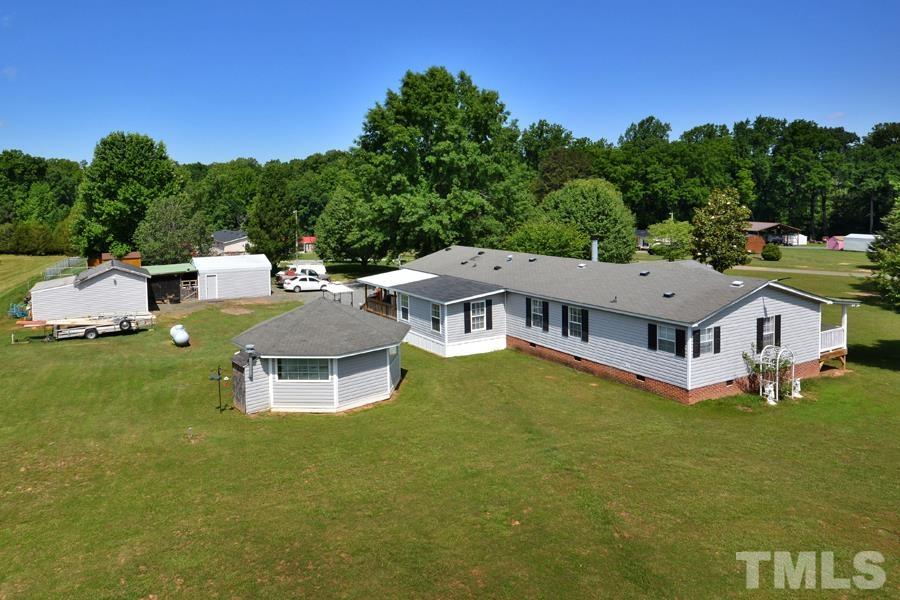 548 Duke Drive Rougemont, NC 27572 - Photo 30 of 43 a aerial view of a house with a garden and deck