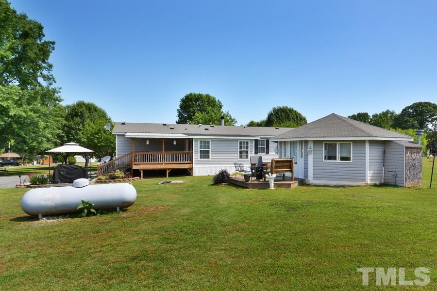 548 Duke Drive Rougemont, NC 27572 - Photo 31 of 43 a front view of a house with garden