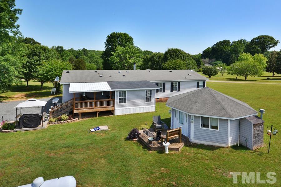 548 Duke Drive Rougemont, NC 27572 - Photo 32 of 43 an aerial view of a house with swimming pool garden and mountain view