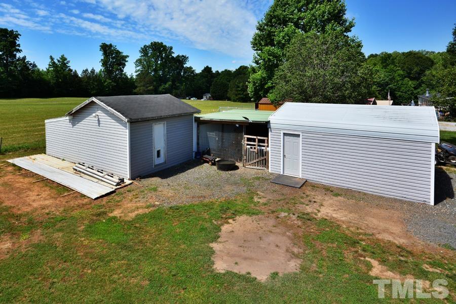 548 Duke Drive Rougemont, NC 27572 - Photo 34 of 43 a view of a white house with a yard and garage