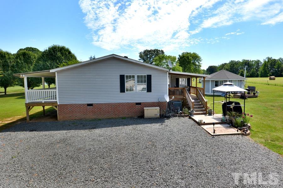 548 Duke Drive Rougemont, NC 27572 - Photo 35 of 43 a view of backyard with a car parked in it