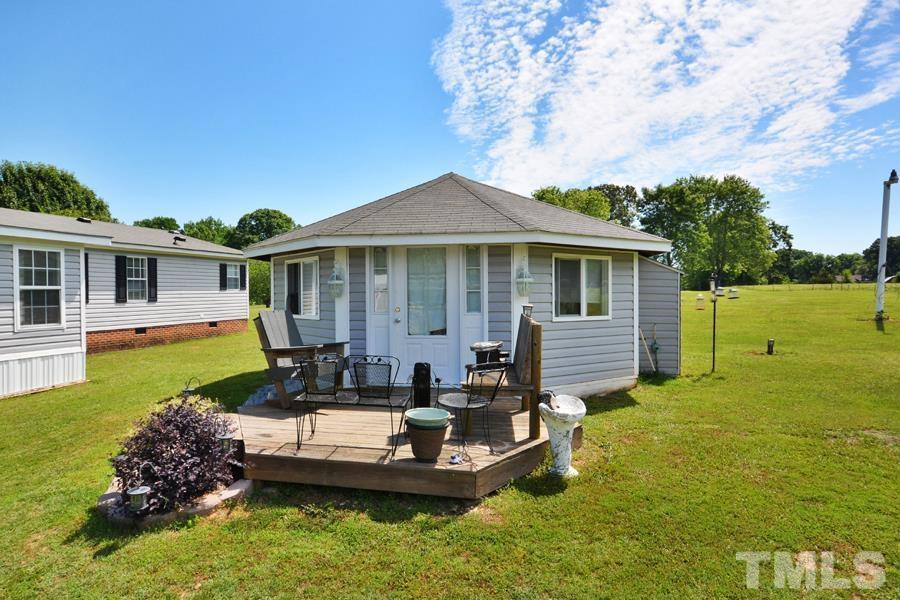 548 Duke Drive Rougemont, NC 27572 - Photo 42 of 43 a house view with swimming pool and garden space