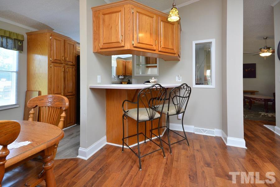 548 Duke Drive Rougemont, NC 27572 - Photo 5 of 43 a view of a dining room with furniture and wooden floor