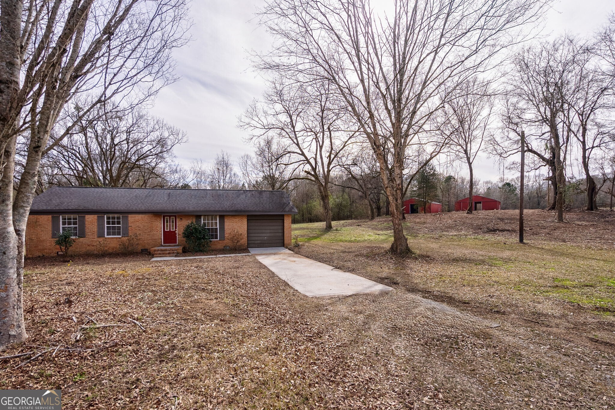 252 Raytown Road Northeast Crawfordville, GA 30631 - Photo 1 of 36 a view of a house with a yard covered in snow