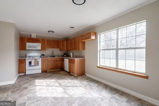 a view of dirt yard with a large tree
