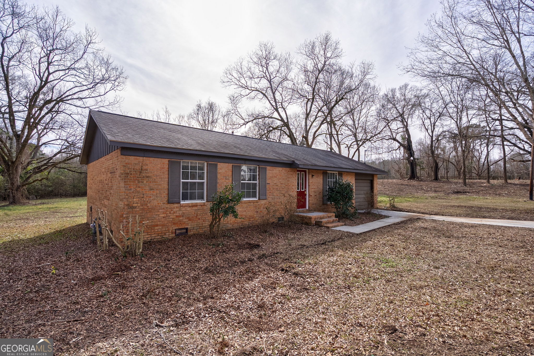 252 Raytown Road Northeast Crawfordville, GA 30631 - Photo 29 of 36 a view of a house with a yard and large tree