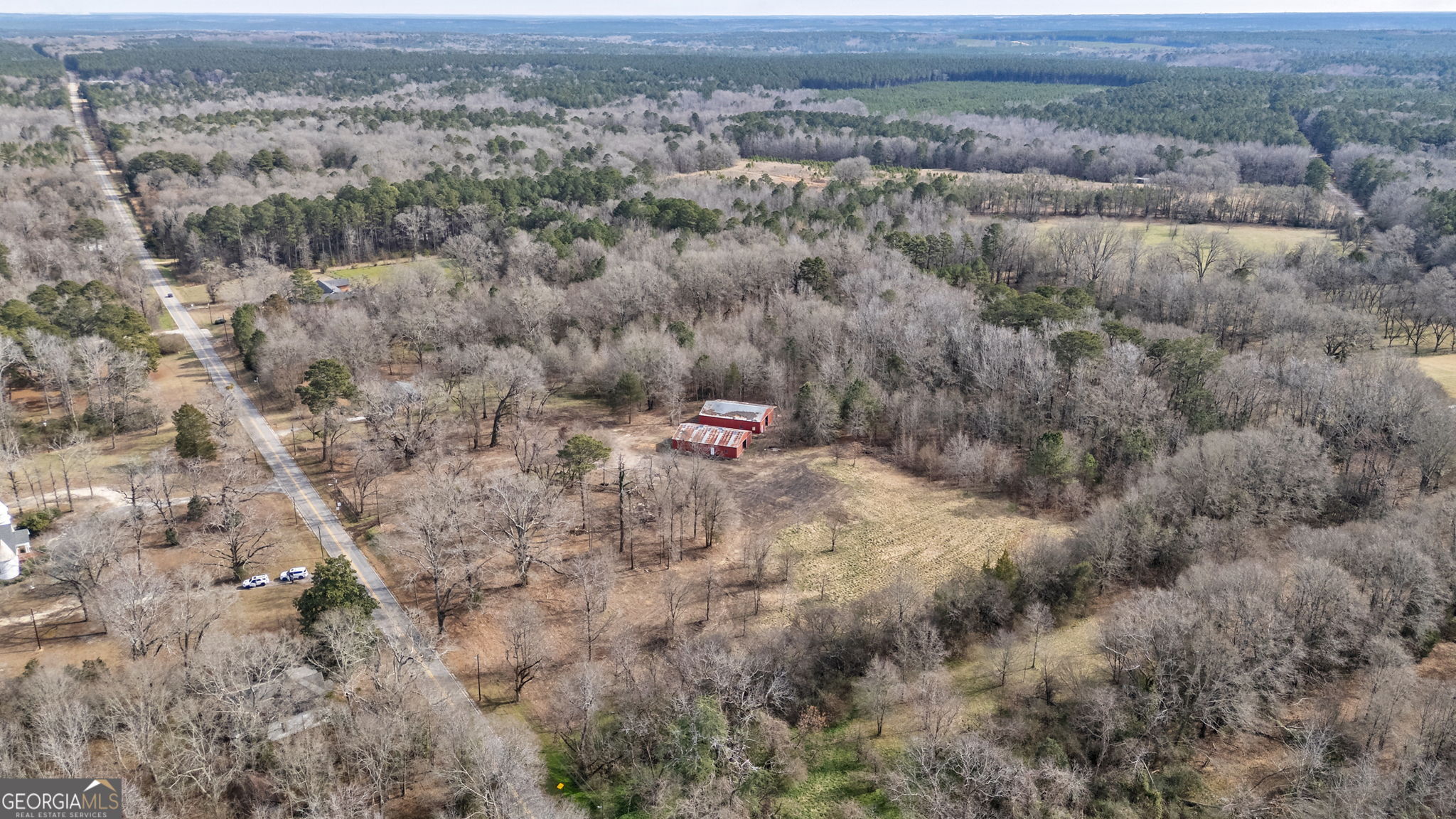252 Raytown Road Northeast Crawfordville, GA 30631 - Photo 33 of 36 an aerial view of residential houses with outdoor space and trees
