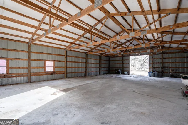 a view of an empty room with a windows