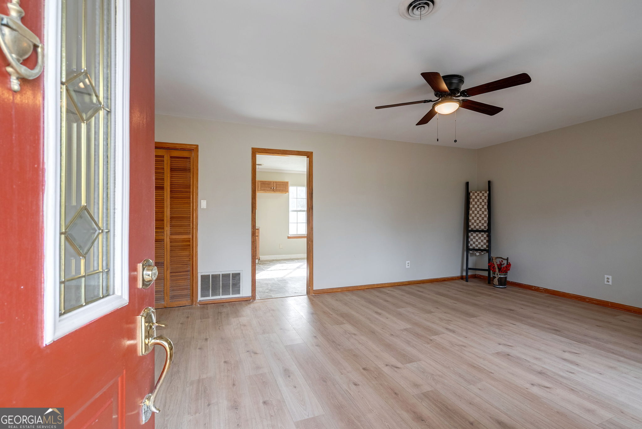252 Raytown Road Northeast Crawfordville, GA 30631 - Photo 9 of 36 wooden floor in an empty room with a window