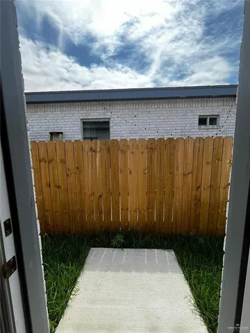 a house view with a backyard space