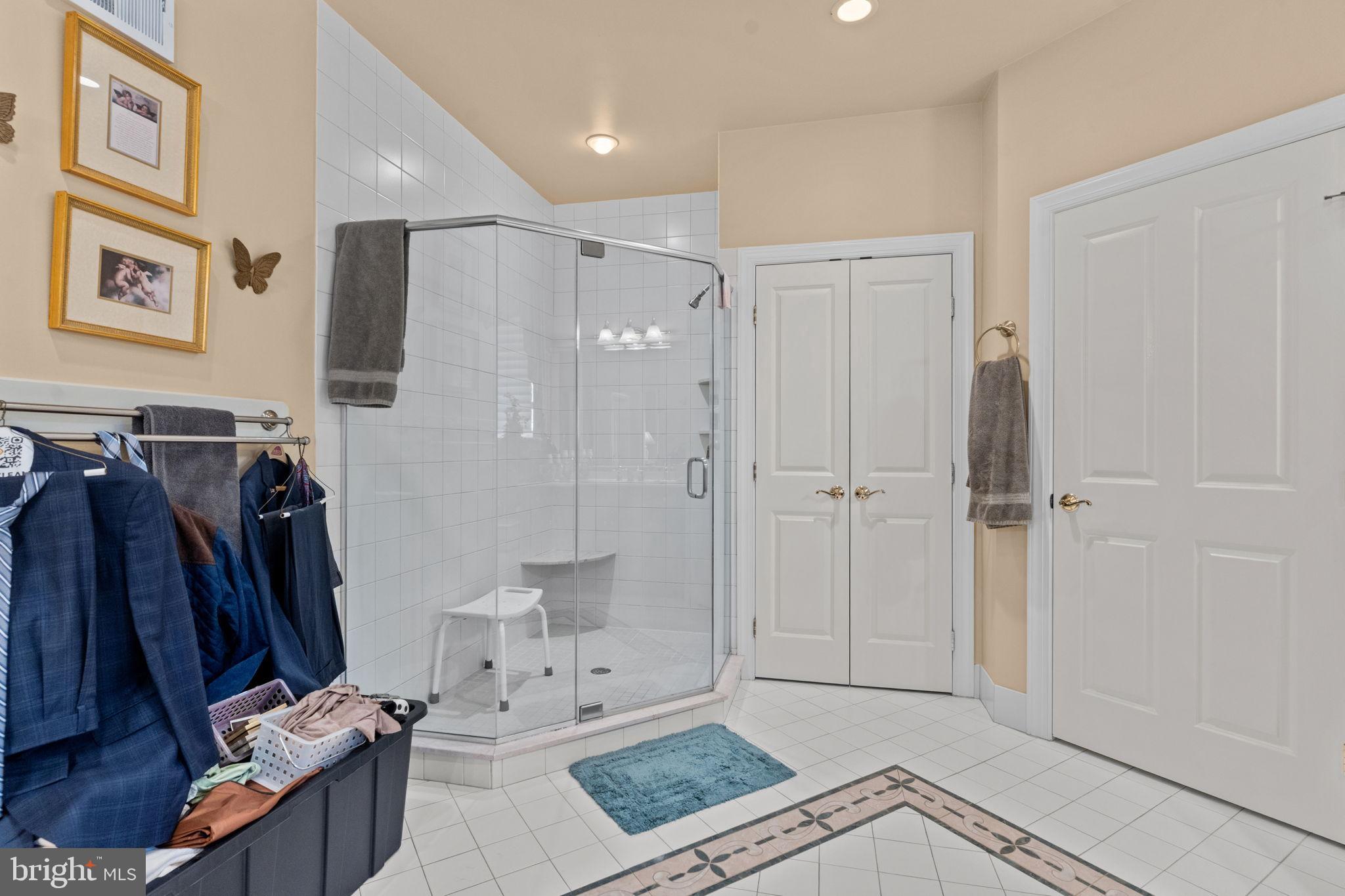 2175 Jefferson Lane Huntingdon Valley, PA 19006 - Photo 33 of 95 a view of walk in closet with clothes and shoes