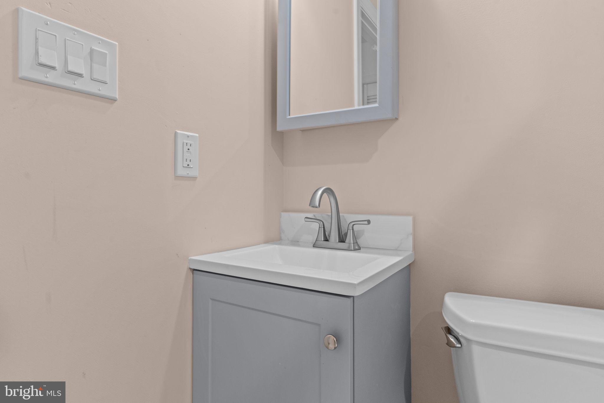 2175 Jefferson Lane Huntingdon Valley, PA 19006 - Photo 46 of 95 a bathroom with a sink a toilet and a mirror