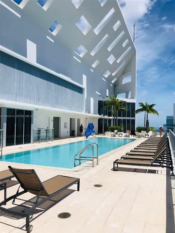 a view of yard with outdoor seating and mountain view in back